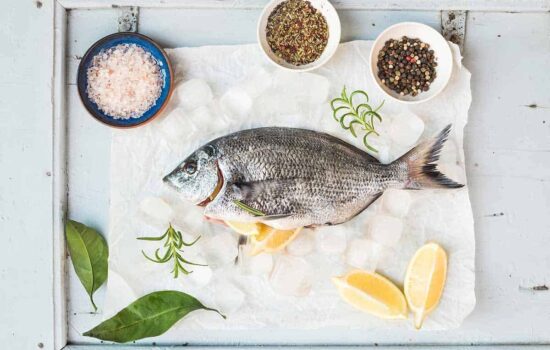 Sea bream fish with lemon, herbs