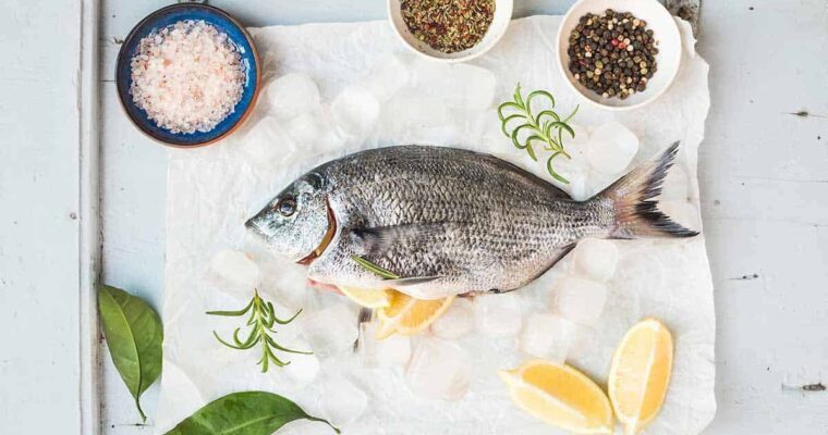 Sea bream fish with lemon, herbs