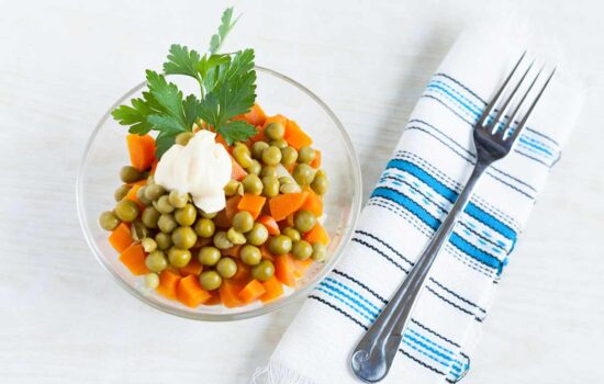 Vegetarian salad with canned peas, boiled carrots